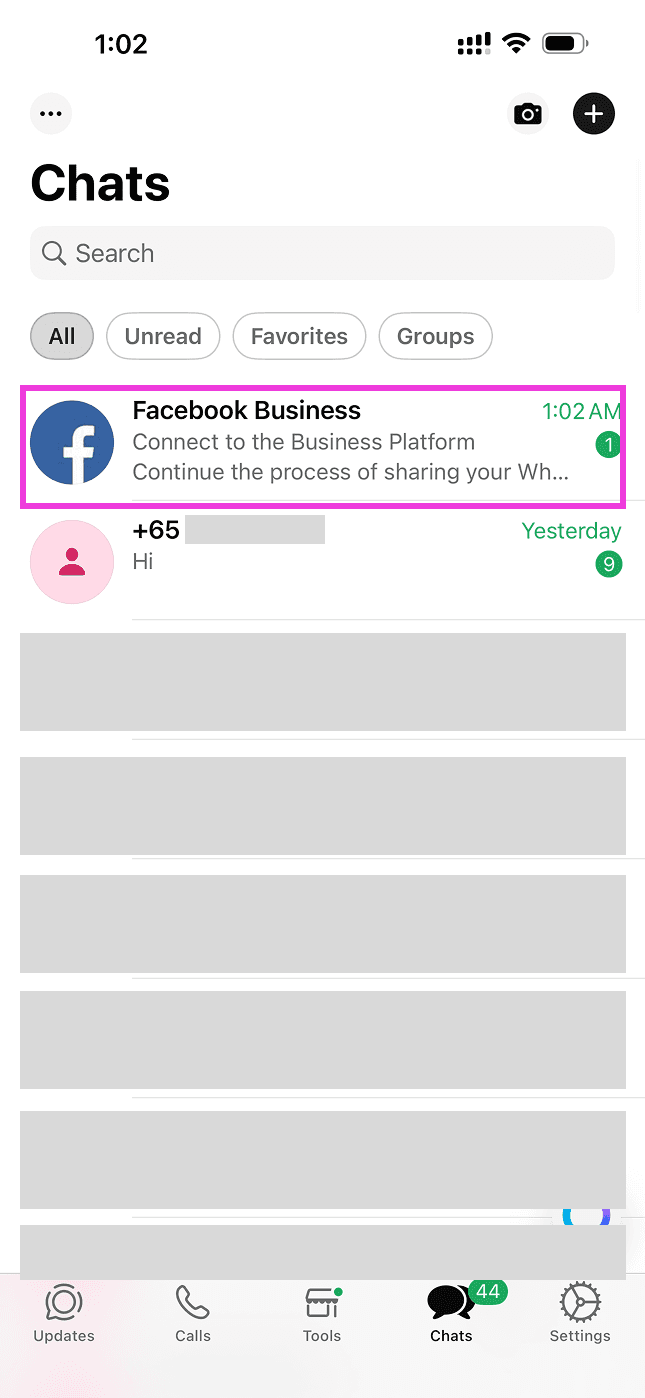 WhatsApp Business app chat list showing a new message from Facebook Business